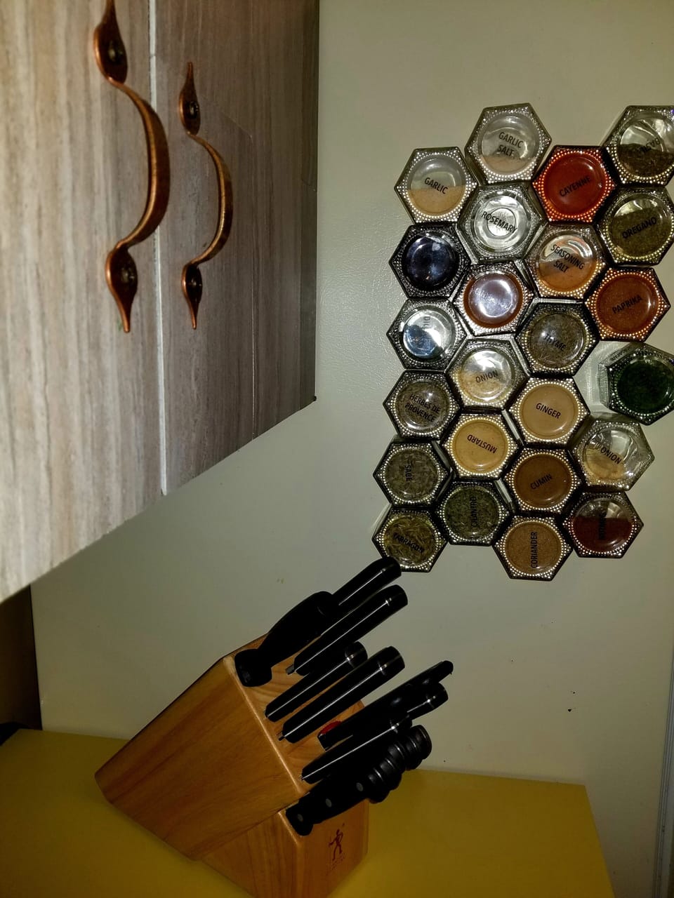 spices on refrigerator and knife set