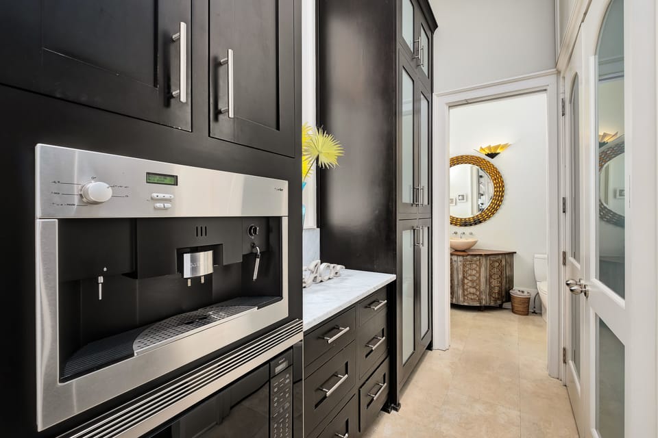 In home miele coffee center, washer and dryer, guest bathroom with full shower