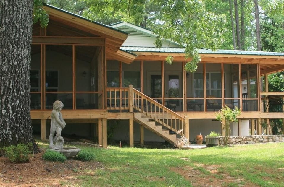 Screened in porch with easy direct stair access to the beach and firepit