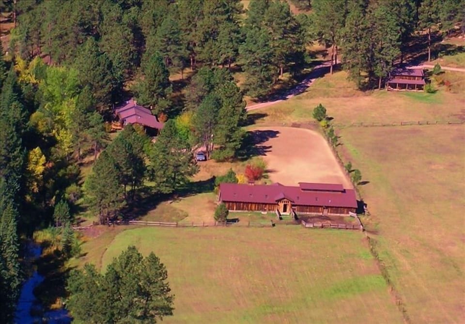 Aerial shot: Jim Creek (bottom L) barn/gallery (center) house (L) cabin (top R).
