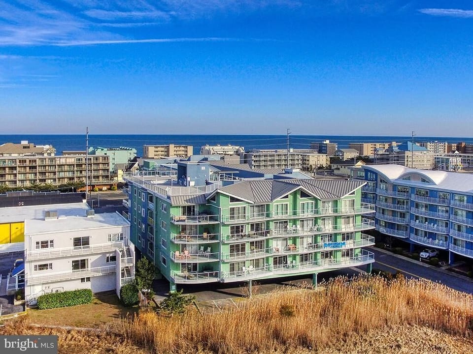Arial view of condo building looking east towards the beach and ocean.