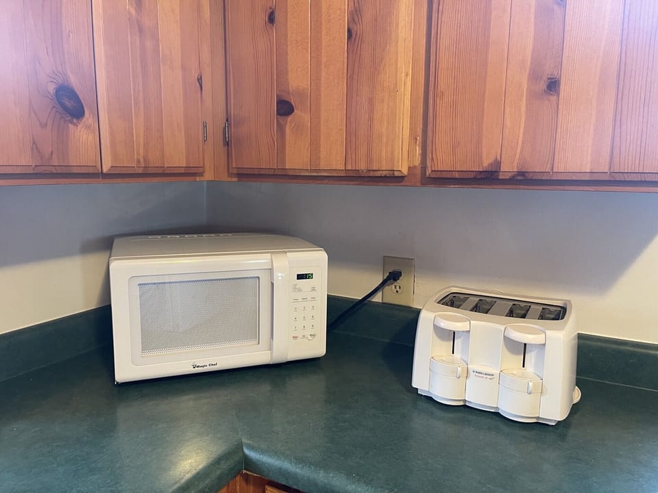 Microwave, toaster.  Kitchen is more than fully stocked with all essentials