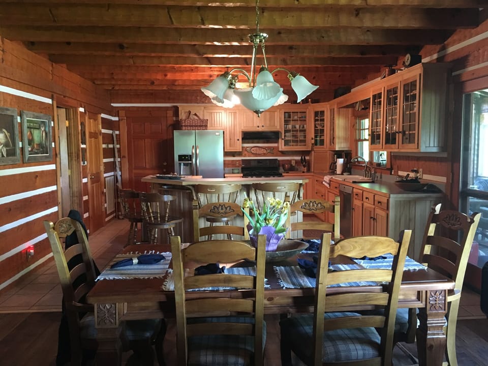 Inside dining table and island bar seating.  Overlooks lake great views!