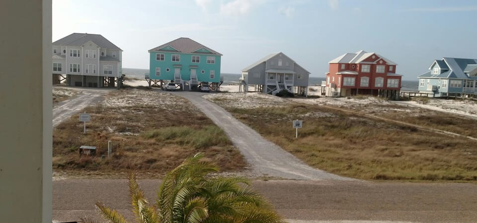 View of Gulf from porch; the perfect place to sit & rock, see and hear the waves