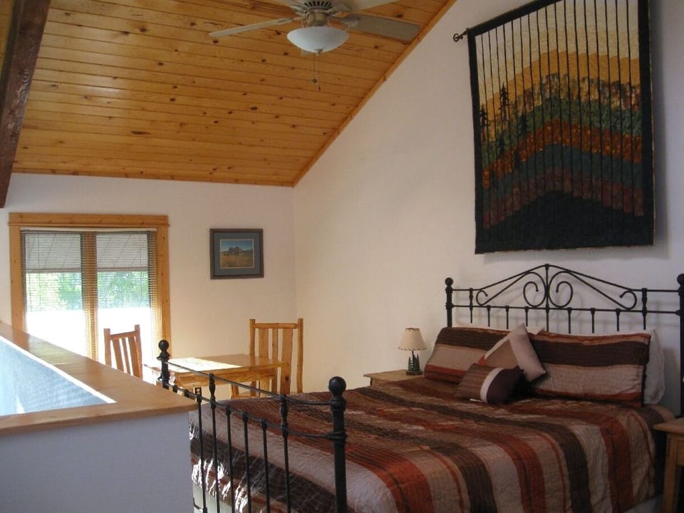 Downtown and river views from king size bed in the upstairs loft