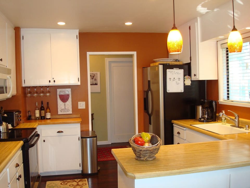 Kitchen with lots of counter space and wine glasses