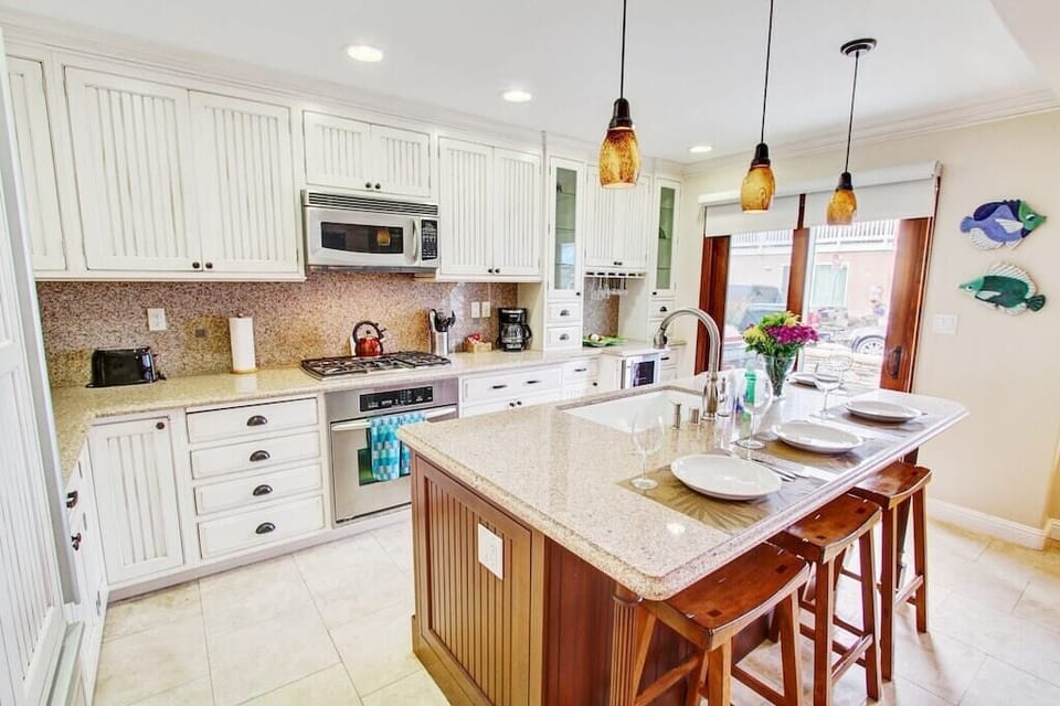 Dishwasher, large refrigerator and 12 cup coffee maker, cookware and dinnerware! 