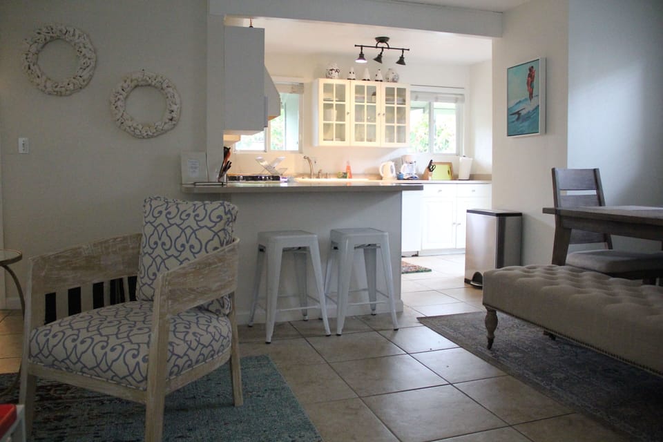 Fully stocked kitchen opens up to dining and living room.