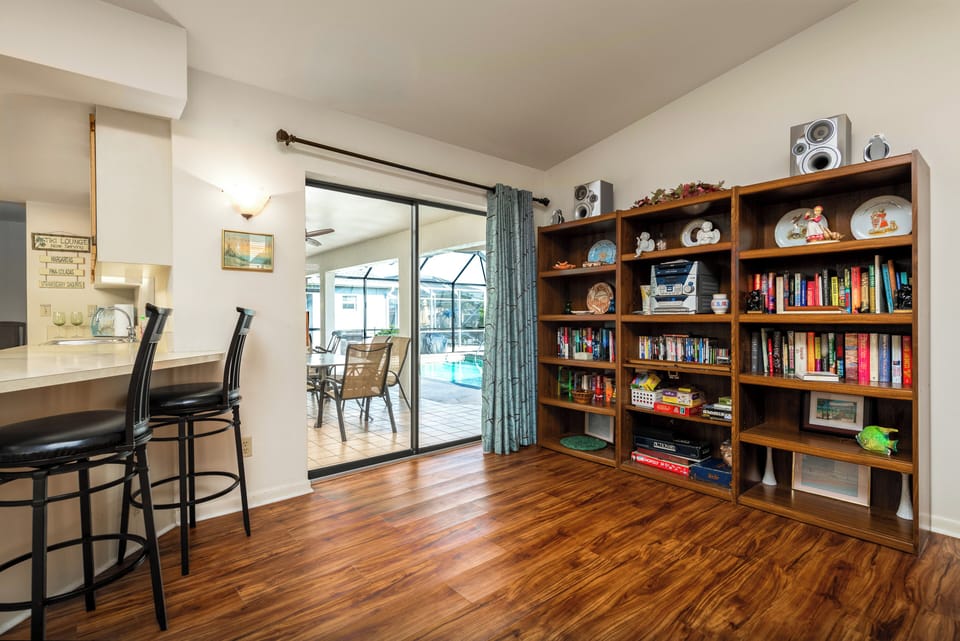Open floorplan and breakfast bar are key features in the family room.