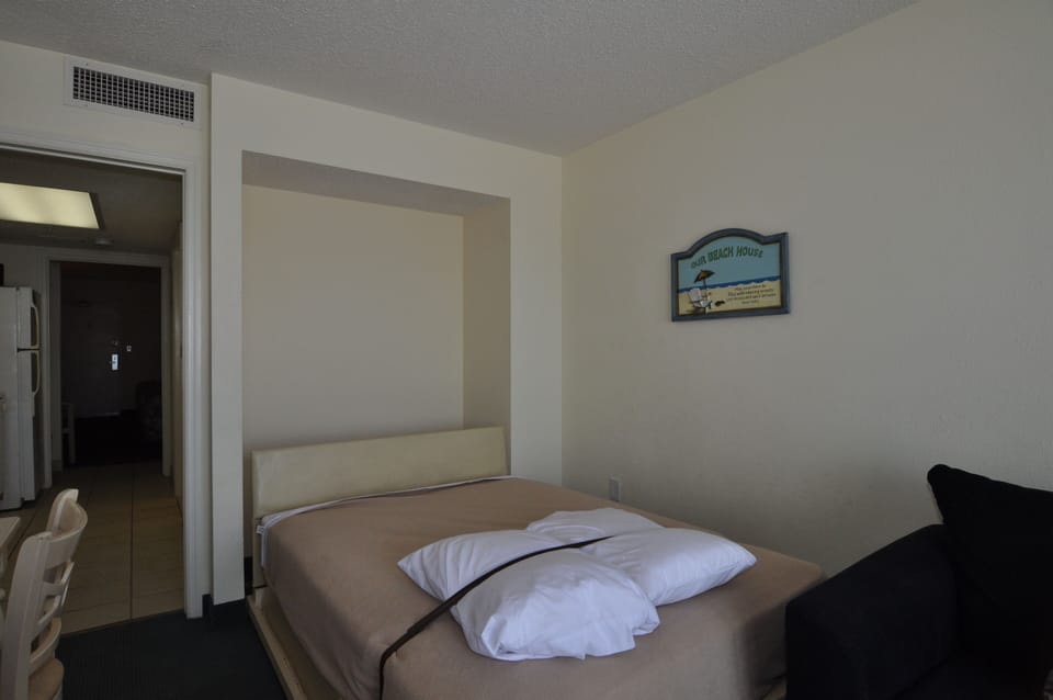 Murphy bed pulls down from wall in living room