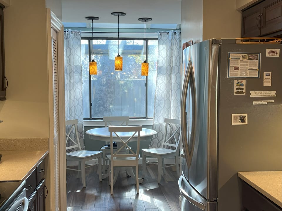 View of breakfast nook and bike yard beyond