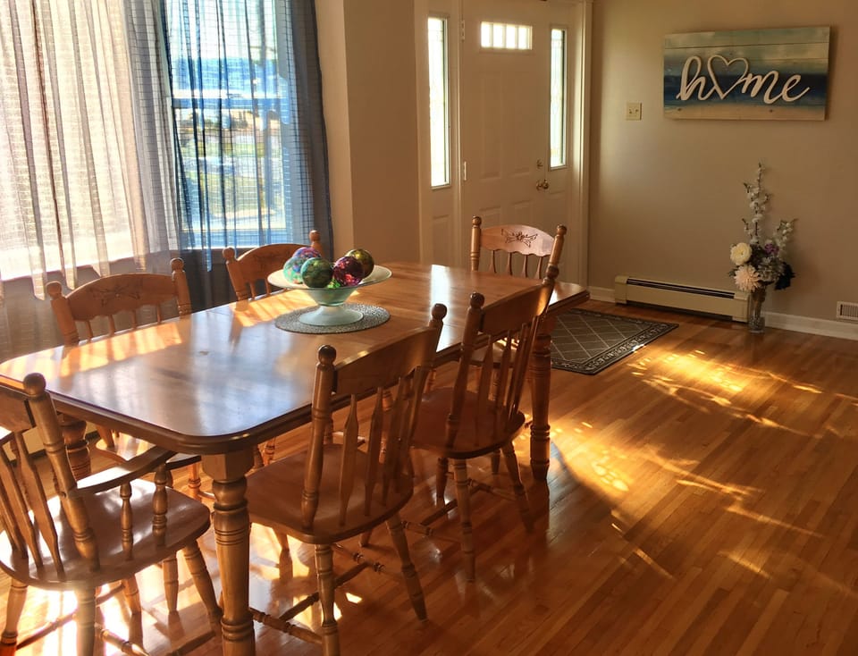 View of the Dining Room and front entrance.  Table can seat 8