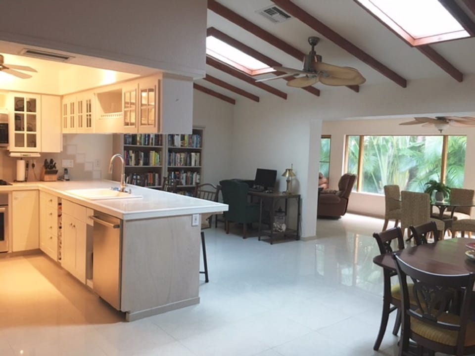 Kitchen opens to "office space" and two dining areas.