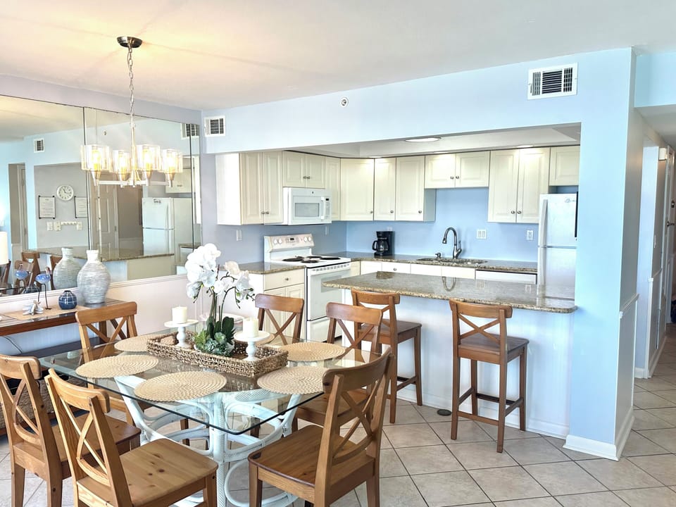 Bright kitchen and dining, large counters, all with mesmerizing gulf views