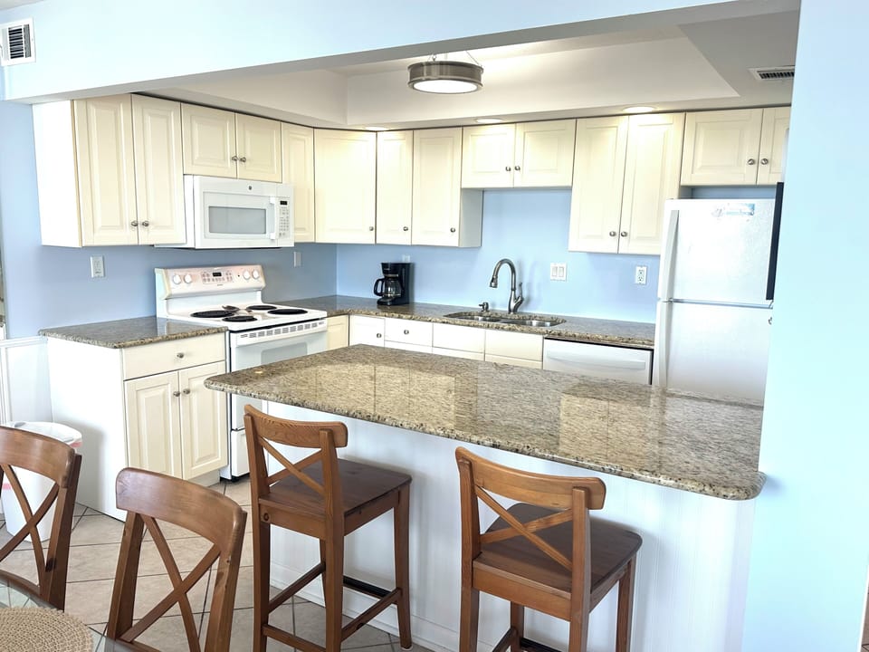 Open kitchen with counter height stools and beautiful gulf views while cooking!