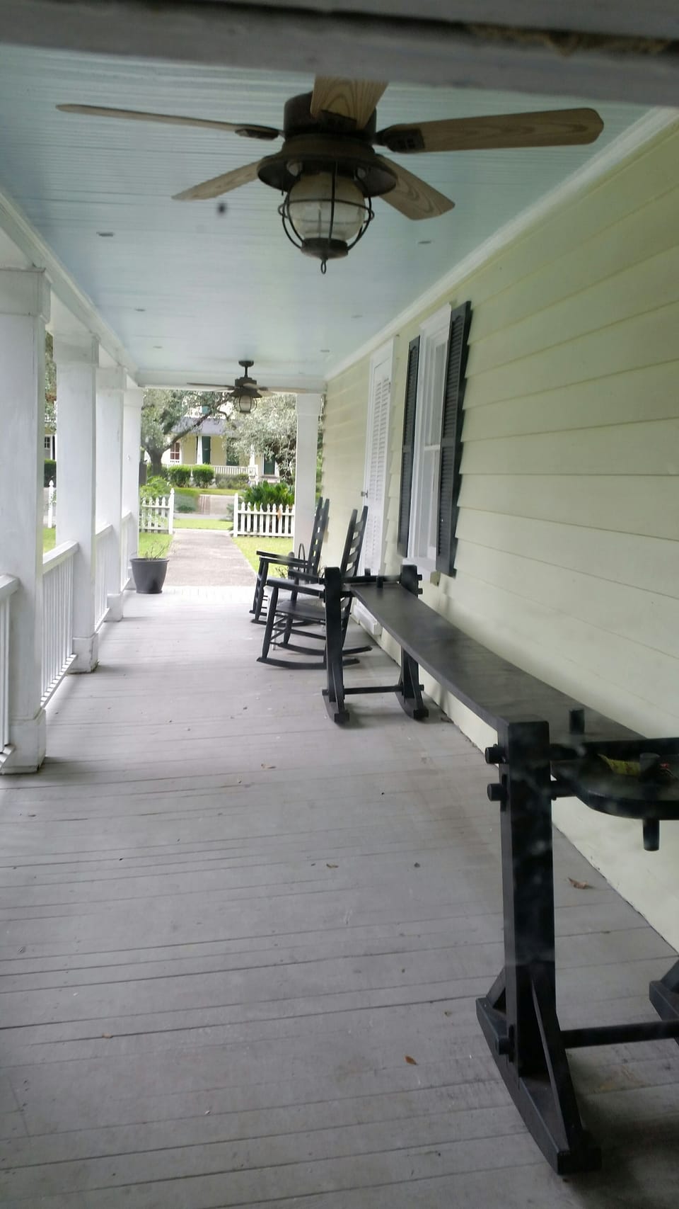 Front Porch with Joggling Board and Rocking Chairs
