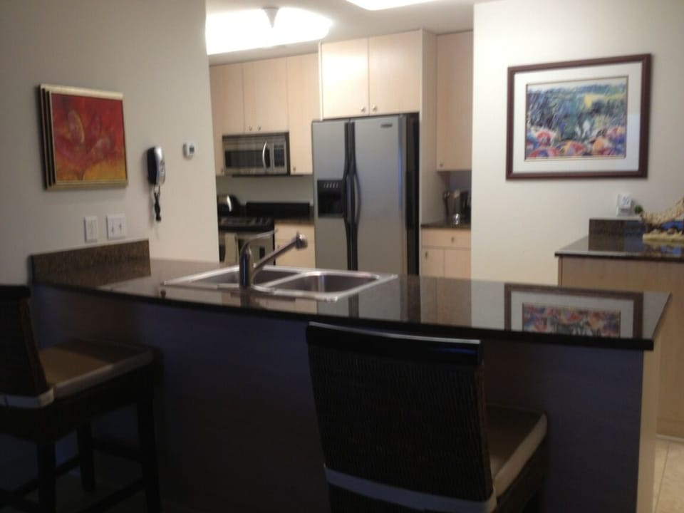 It's all there! Granite counters, ss appliances, microwave, DW, toaster, coffee maker, glass & dinnerware for (6), cook & bakeware, utensils & other essentials. 
