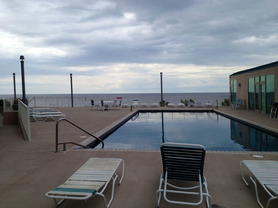 Splish Splash! Pool side view of  Gulf waters & beach. Steps to cabana & bath.