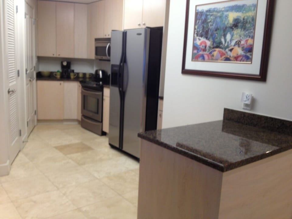 View of kitchen's prep area with granite counter top. 