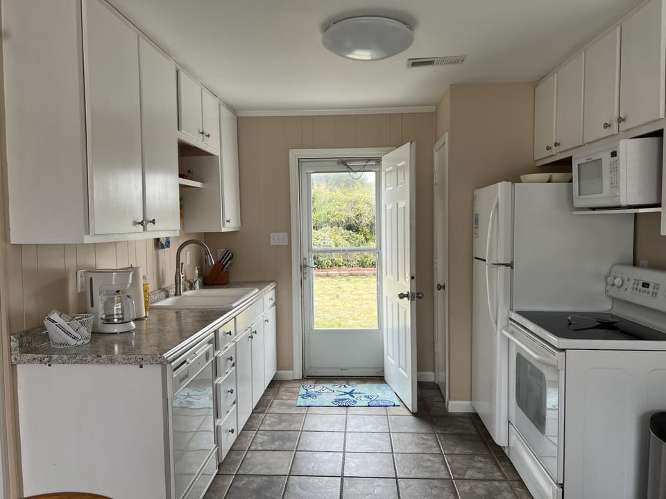 Kitchen Area with Dishwasher, Full Size Refrigerator and Stove