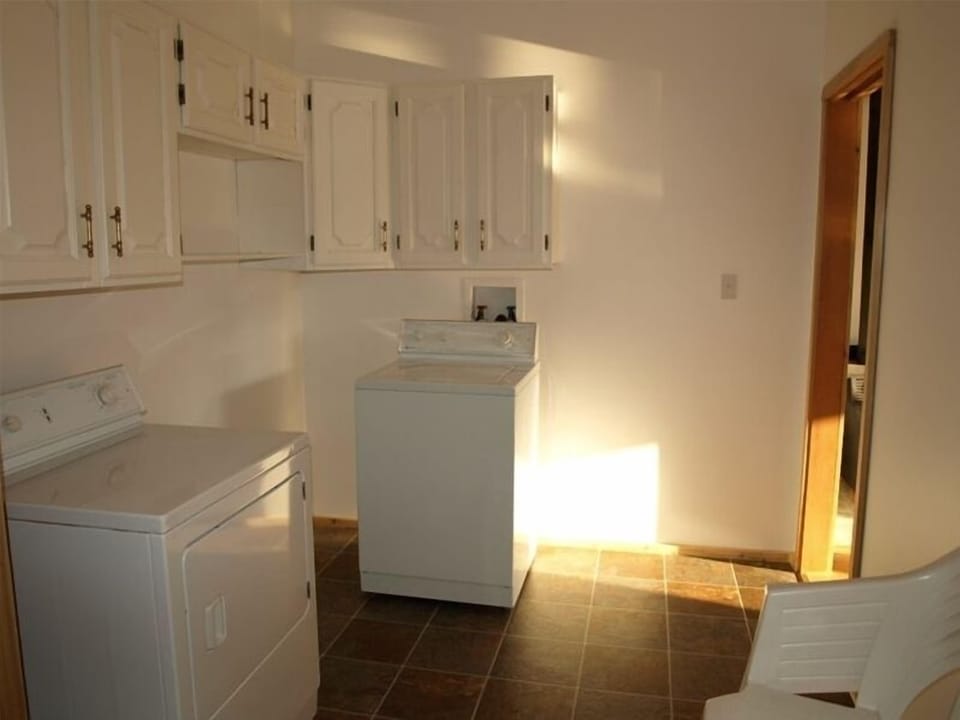 Utility room with washer and dryer