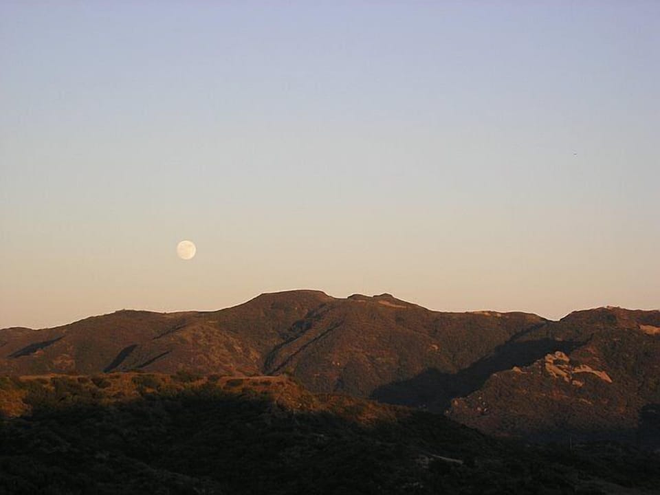 August Harvest Moonrise over Topanga State Park. Taken from patio. 
