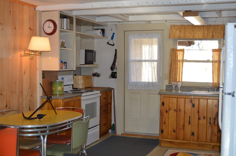 Kitchen with all of the pots, pans, dishes & accessories you will need