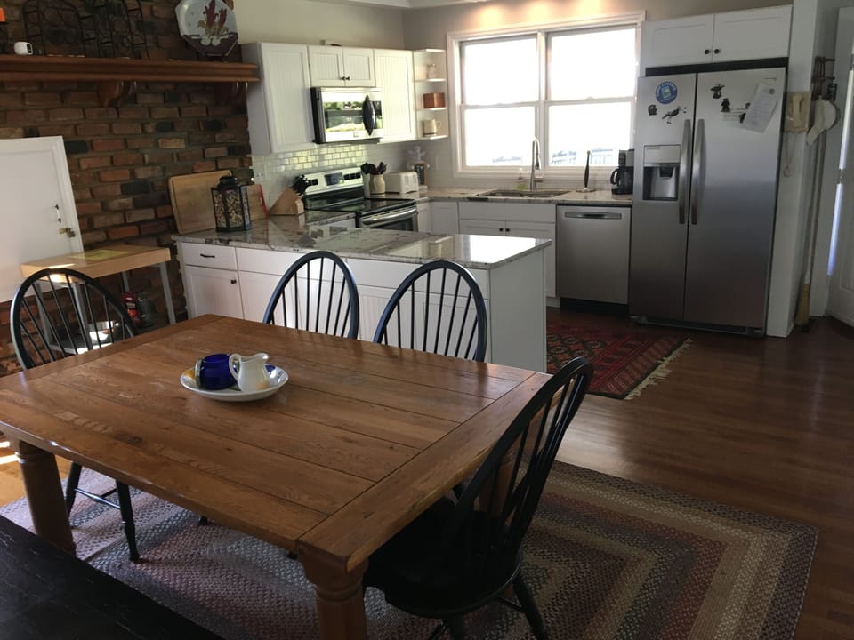 Dining/kitchen combo steps from the family room and all the action.