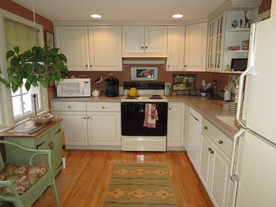 The kitchen is very well equipped with cookware, dishes and a stocked spice rack