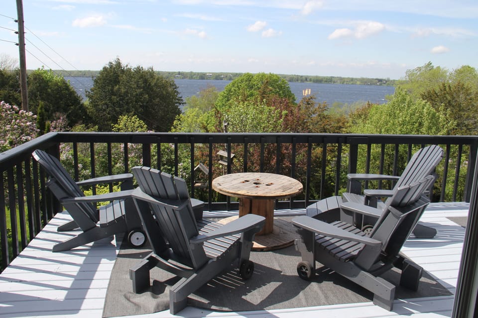 Relax on the deck and enjoy the sailboats cruising by with a beverage in hand.