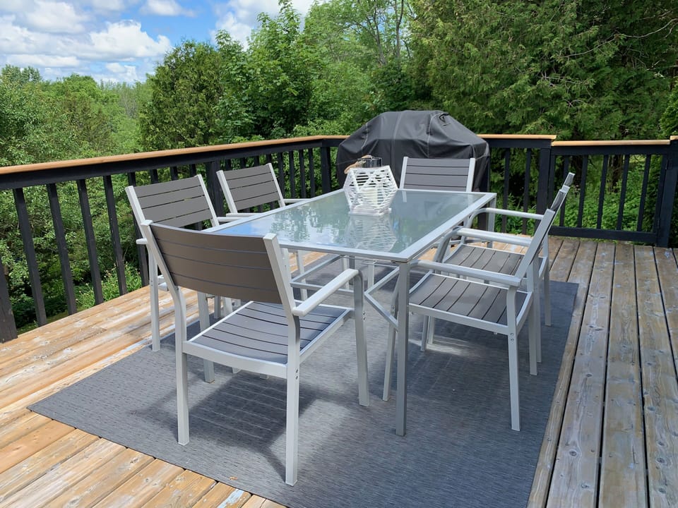 Spacious deck with dining area (and lounge area shown in other photo)