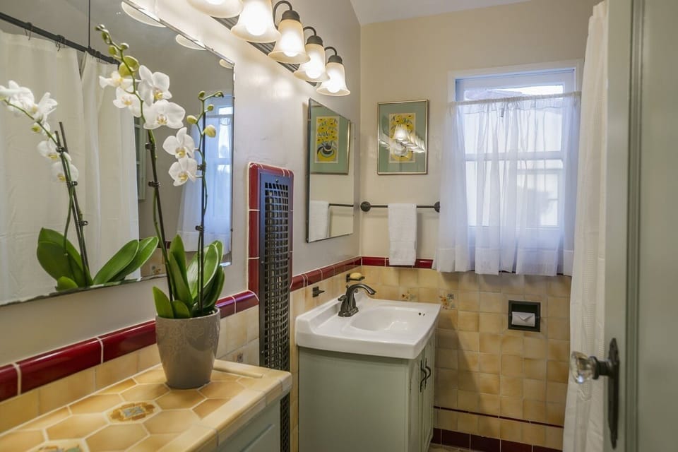 Bath has full bathtub and shower.