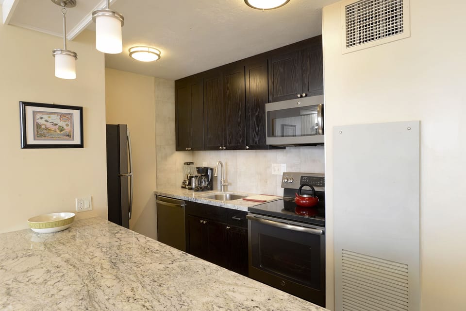 Newly renovated kitchen with granite counter tops and stainless appliances