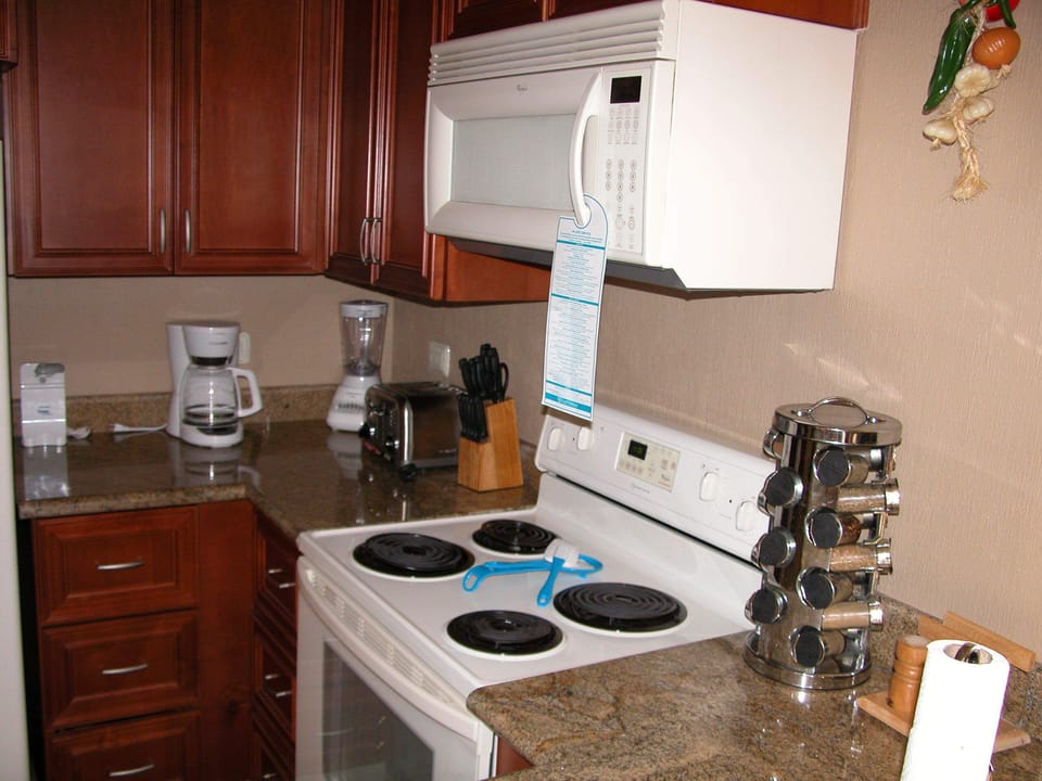 Fully equipped kitchen with granite counter top.