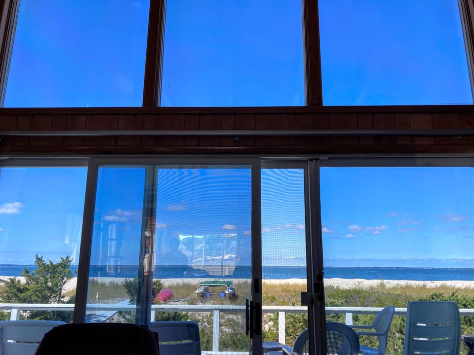 Bay and beach right out the living room window - stunning views, day or night
