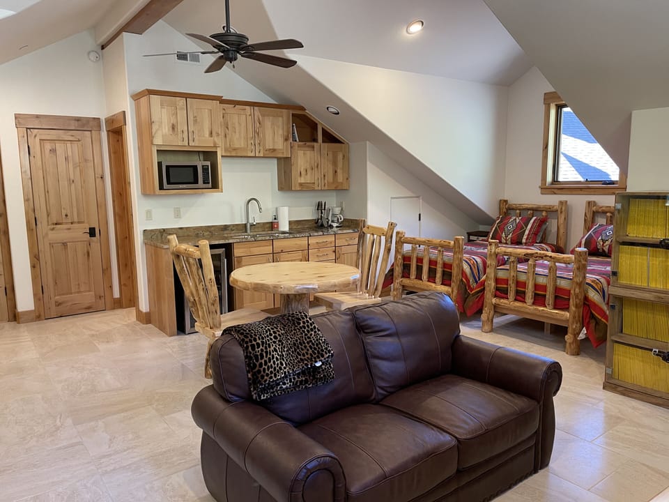 House loft showing kitchenette and twin beds