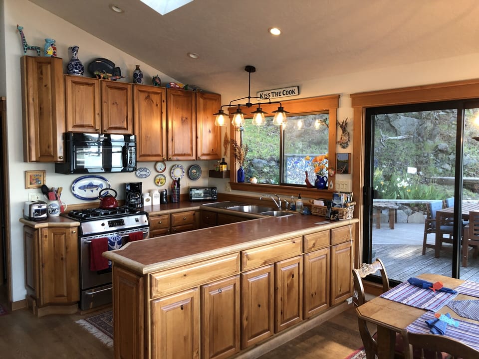 Sunny kitchen open to the great room and upper deck
