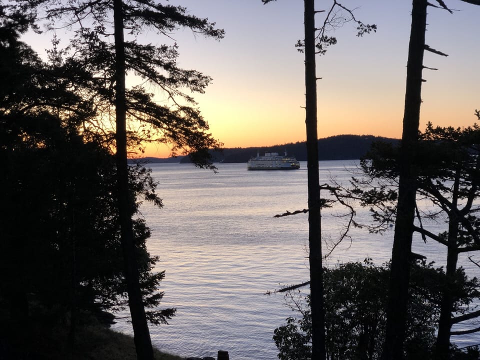 QC sunrise view with an early morning ferry crossing through Harney Channel