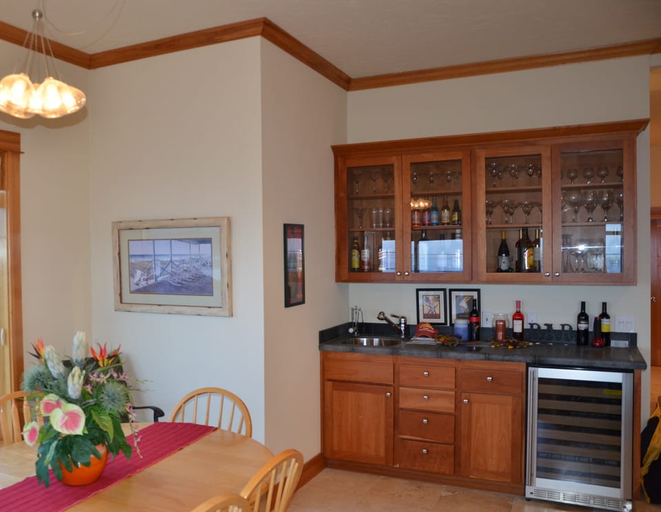 A wet bar and wine cooler are at your disposal. 