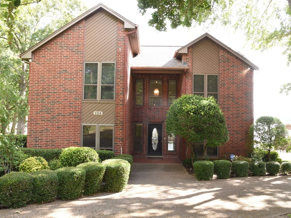 Wheelchair accessible front entry and circular drive with room for 3-4 cars