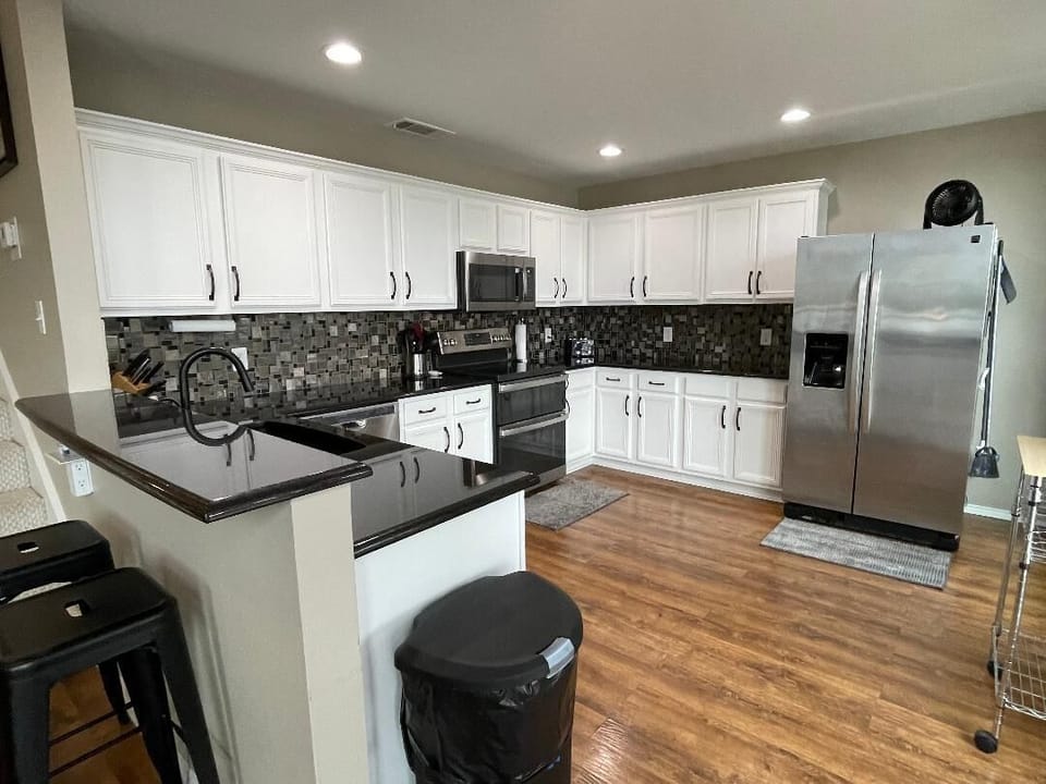 Newly remodeled kitchen with granite countertops and stainless appliances.