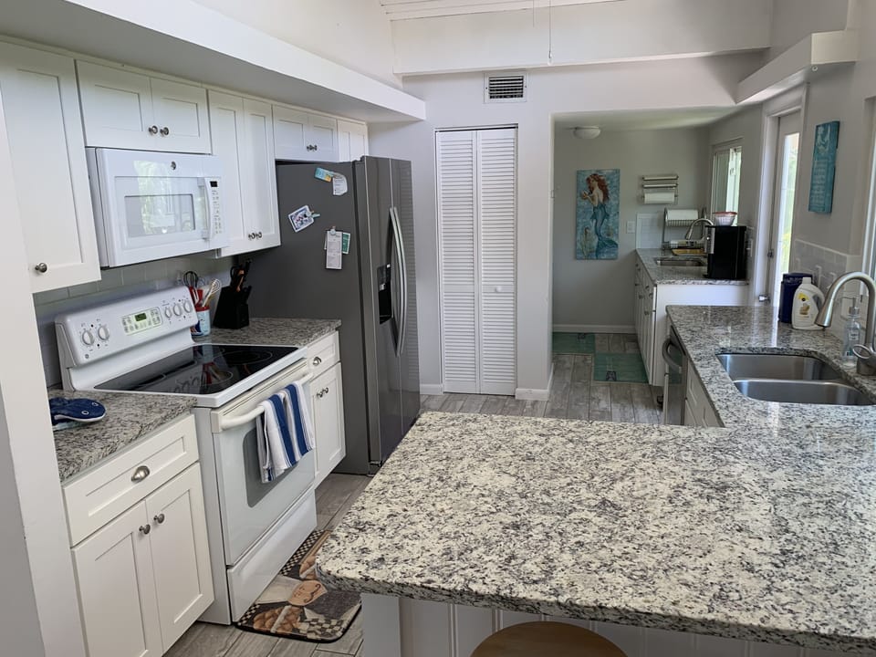 Upstairs Kitchen - Remodeled, Granite countertops, tile flooring, wood cabinets