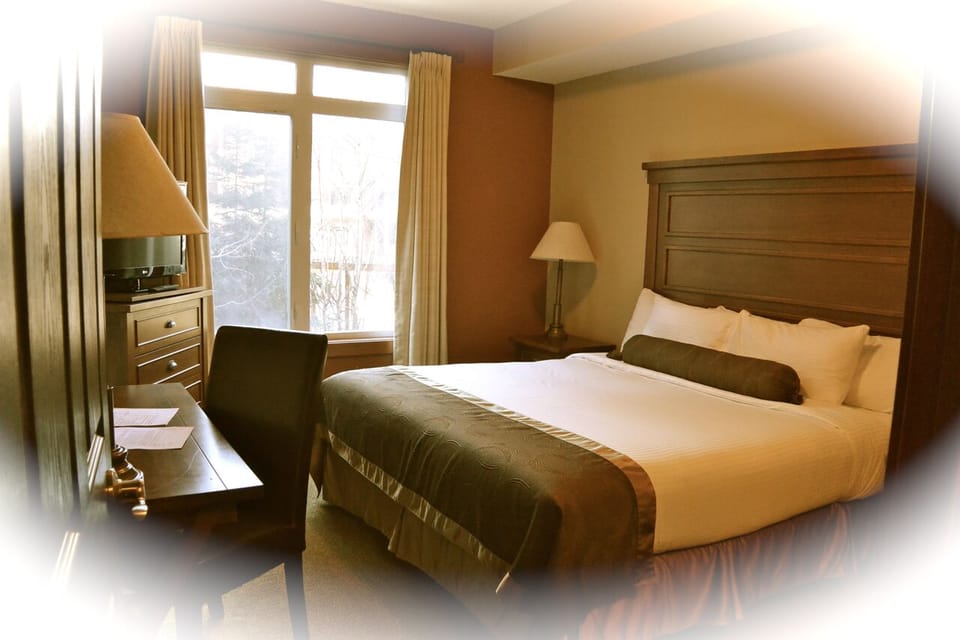 Master bedroom features a King-sized bed.  Have a great sleep!