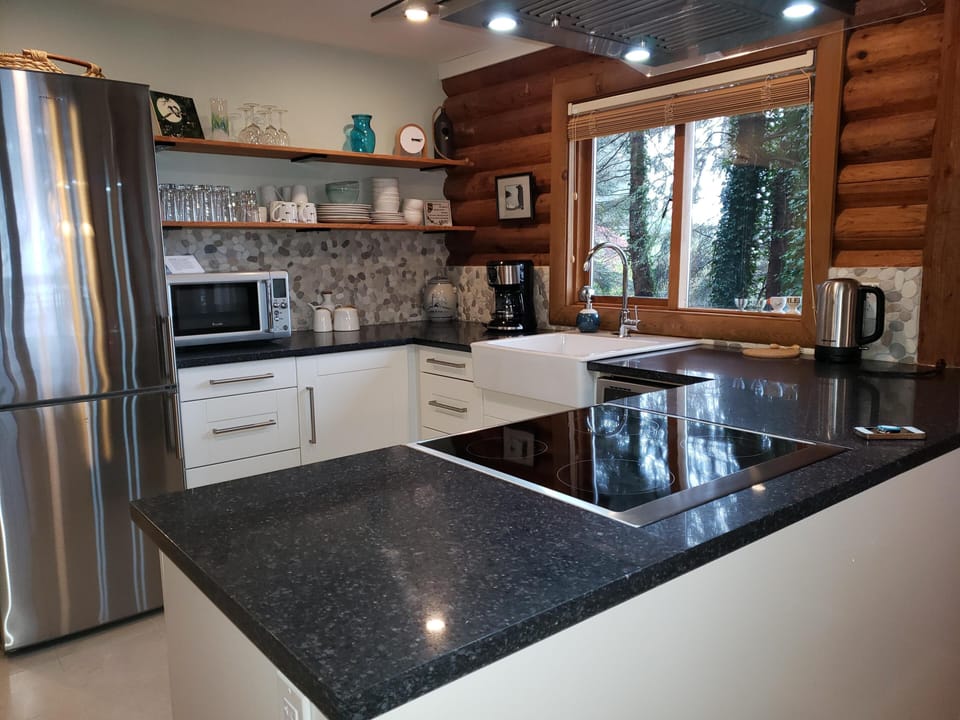 Quartz countertops and porcelain apron sink.