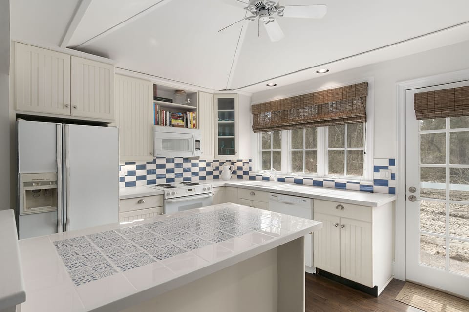 Fully appointed kitchen ready for family meals and entertaining. Opens to patio.
