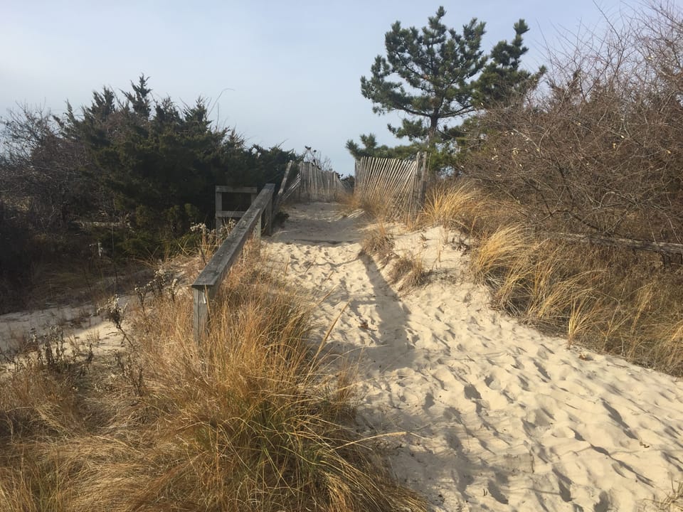 Access and parking pass to private bay beach included.