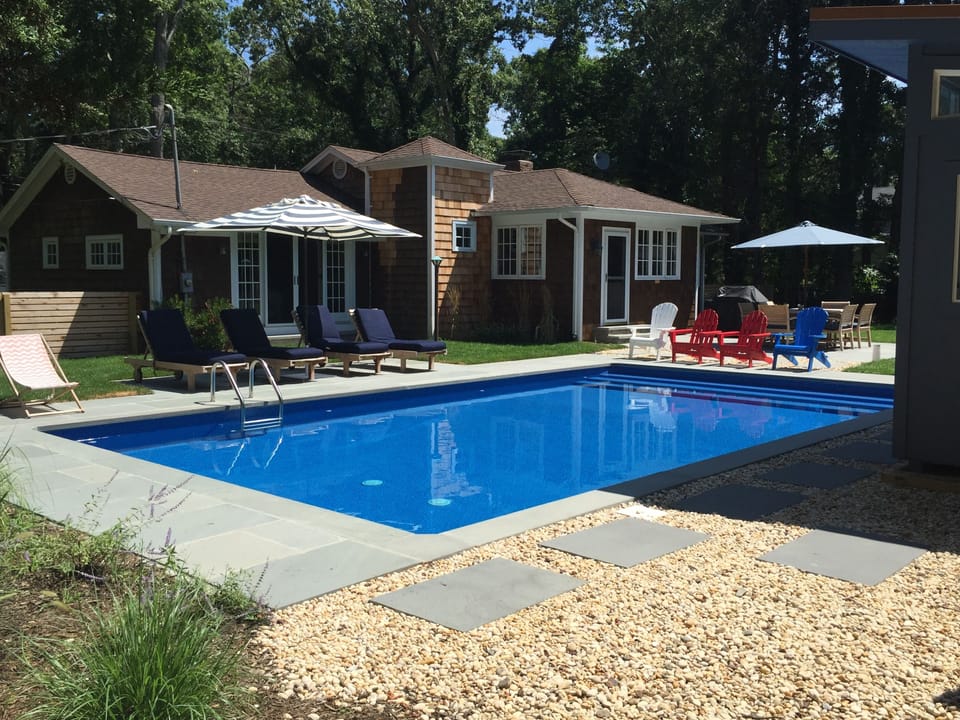 New heated saltwater pool and bluestone patio with relaxing teak loungers.