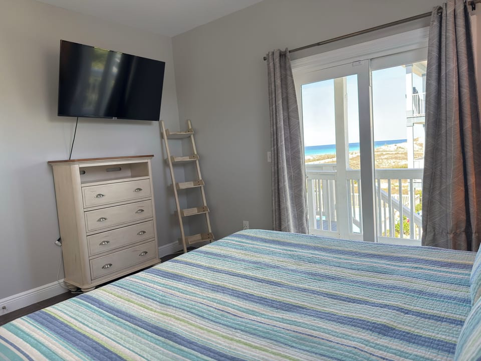 King Bedroom on Main level-Gulf Views. Great views of gulf and access to deck.