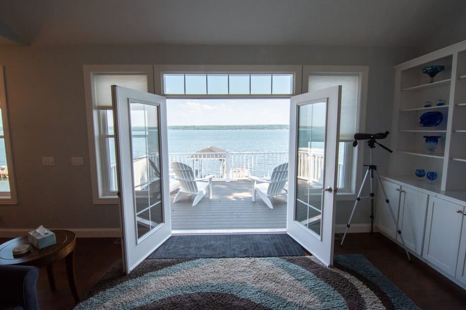 Double french doors to let the outside come in.  This home has lots of light.