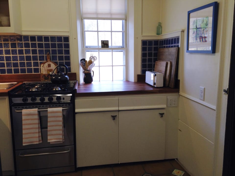 Beautiful cherry wood counters, Mexican floor tiles, Tile back splash 
